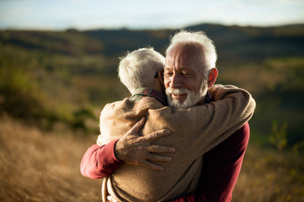 istock Affectionate senior couple embracing in autumn day. 1186886870