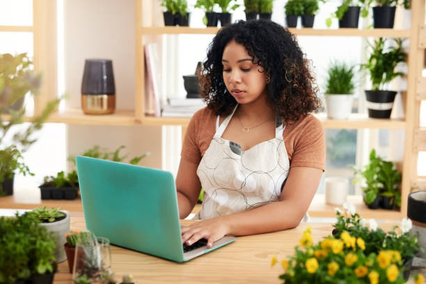 istock Running her business from her laptop 1186888173