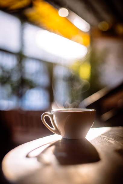 istock Steamy coffee cup in the sunlight 1186888482