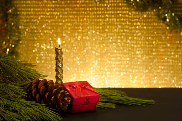 istock Christmas card. Candle, gift box, cone pine and branches. 1186888557