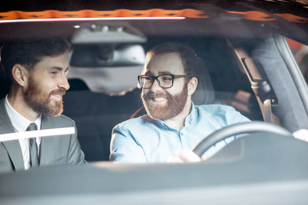 istock Sales manager with a client looking at the vehicle interior 1186888738