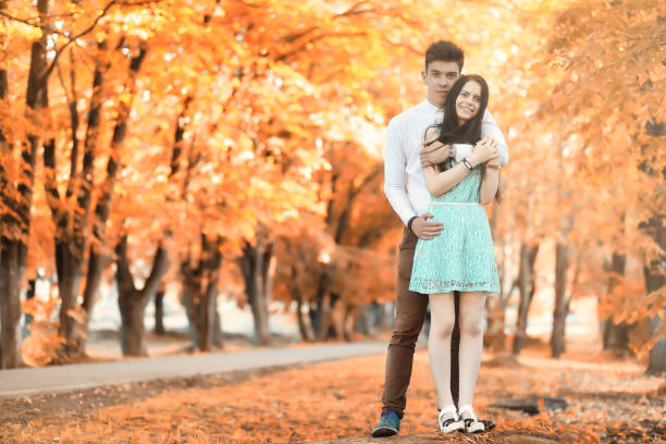 istock Young couple on a walk in autumn park 1186889531