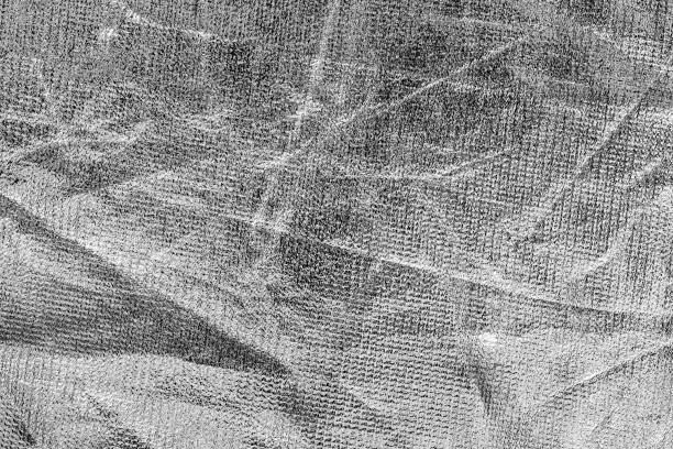 istock Texture of silver crumpled fabric cloth. Abstract background for design with copy space. 1186889716