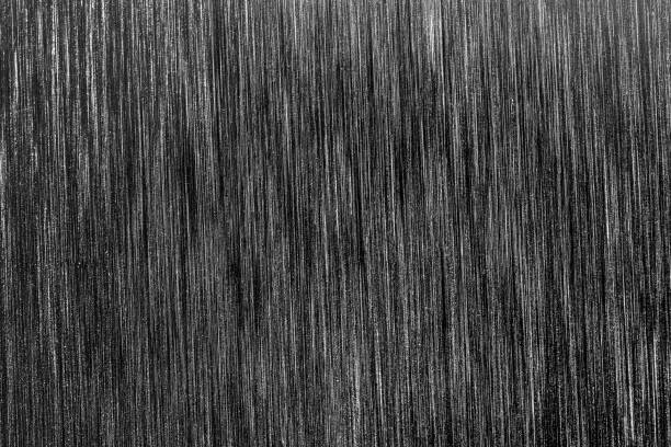 istock Black metal texture with white scratches. Abstract noise black background overlay. 1186889762