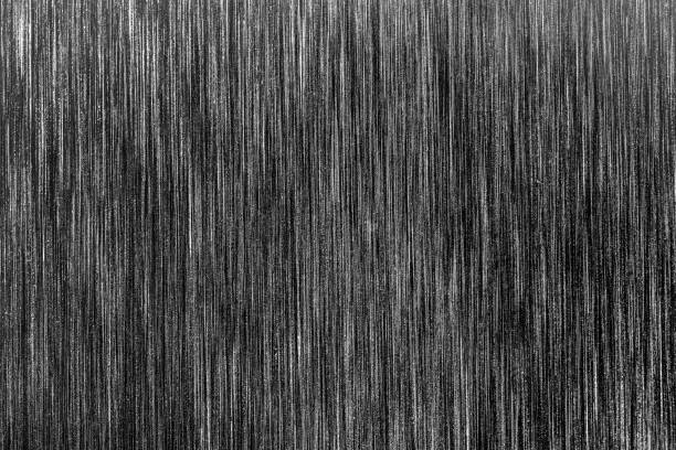istock Black metal texture with white scratches. Abstract noise black background overlay. 1186889768