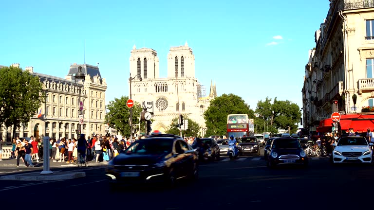 Traffic in Paris with Notre Dame in the background, time lapse