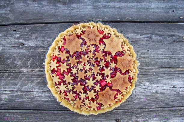 istock Christmas cake with cherry and apple decorated with snowflakes 1186894186
