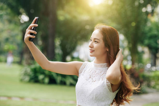 istock Vietnamese woman taking selfie 1186894934
