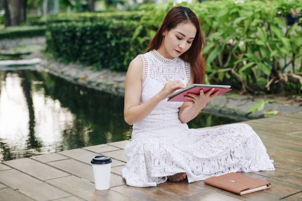 istock Female student resting in park 1186894965