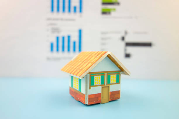 istock A small house in front of a business chart 1186899385