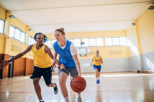 istock Ladies playing basketball indoors 1186899400