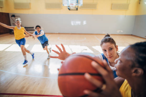 istock Ladies playing basketball indoors 1186899777