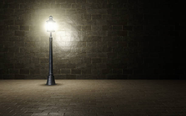istock Illuminated brick wall with old fashioned street light.3d rendering 1186899948