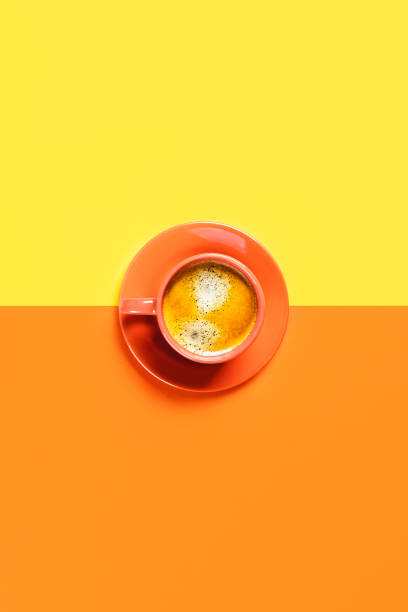 istock One cup of coffee on two-toned background. 1186901410