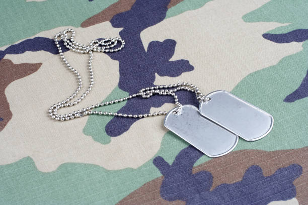 istock US flag patch with dog tags on woodland camouflage uniform 1186902997