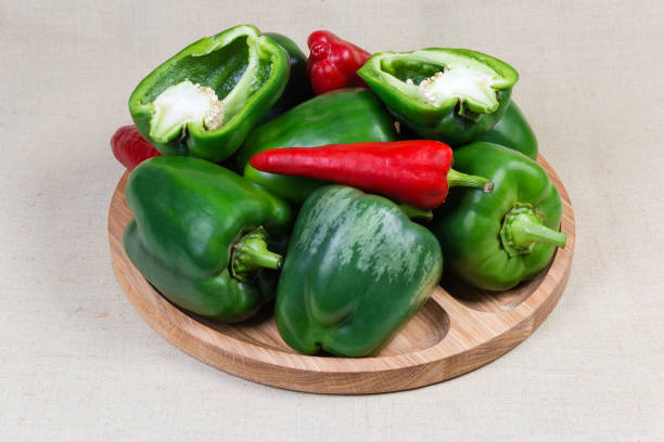 istock Bell peppers on the wooden serving dish on cloth surface 1186903720