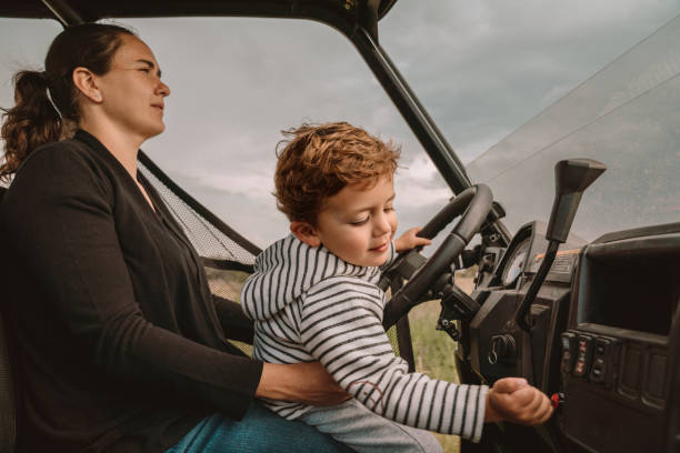 istock Boys having fun at a pickup truck in a Ranch 1186907802