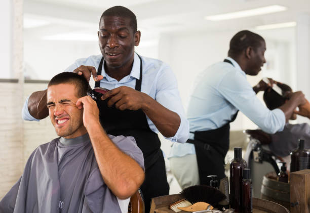 istock Barber hurting male client 1186908158