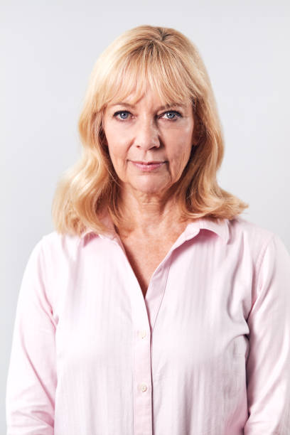 istock Studio Shot Of Mature Woman With Serious Expression Against White Background At Camera 1186908708
