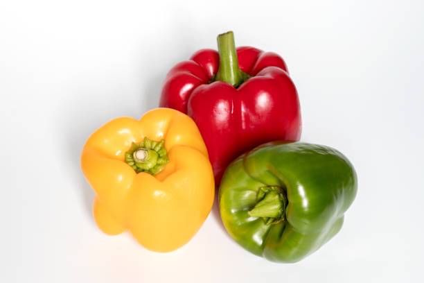 istock Three Red, Yellow, Green Peppers isolated on white background. 1186908813
