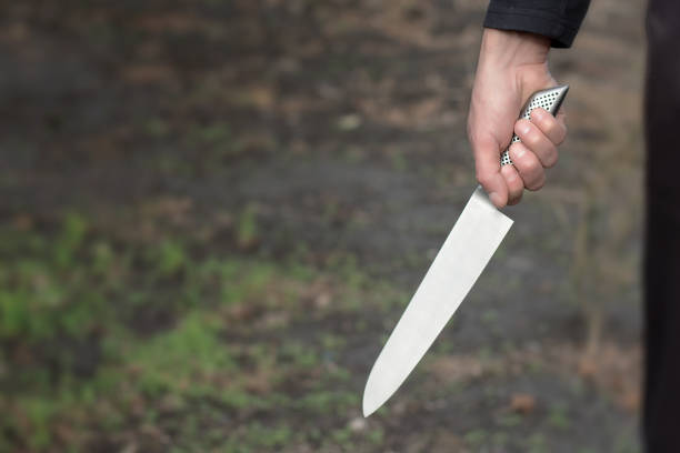 istock The man with a knife in a hand. Closeup 1186908920