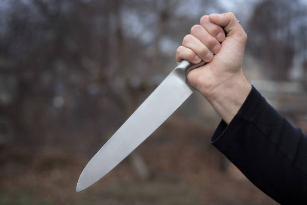 istock The man with a knife in a hand. Closeup 1186908921