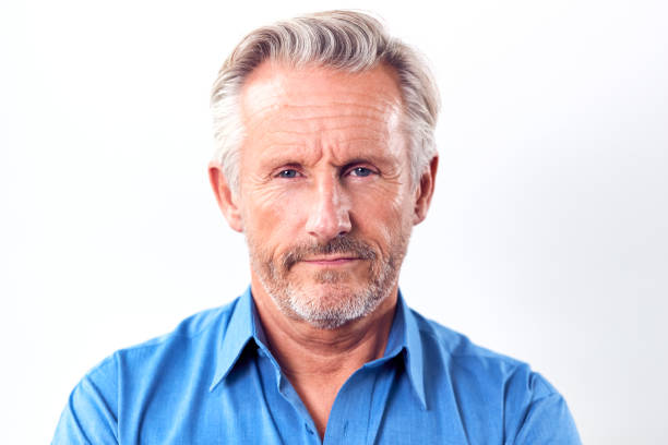 istock Studio Shot Of Mature Man With Serious Expression Against White Background At Camera 1186908929