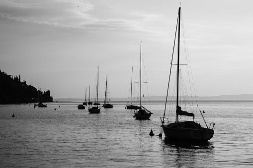 Silhouettes of sailboats on Lago di Garda