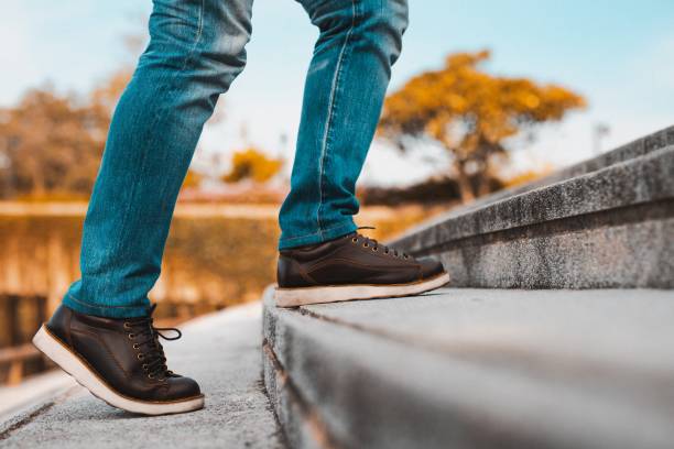 istock image of man up to stair 1186913421