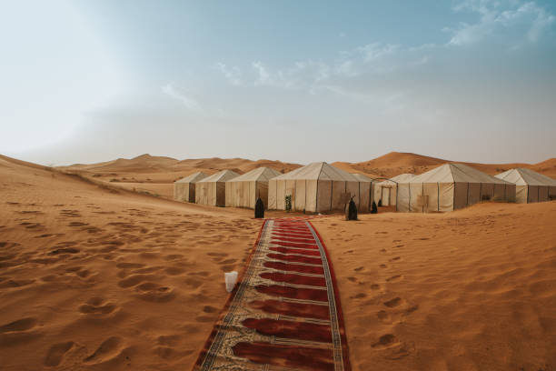 istock Beautiful desert camp on the sand at sunset. 1186914641