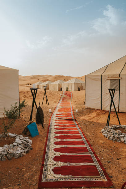 istock Beautiful desert camp on the sand at sunset. 1186914650