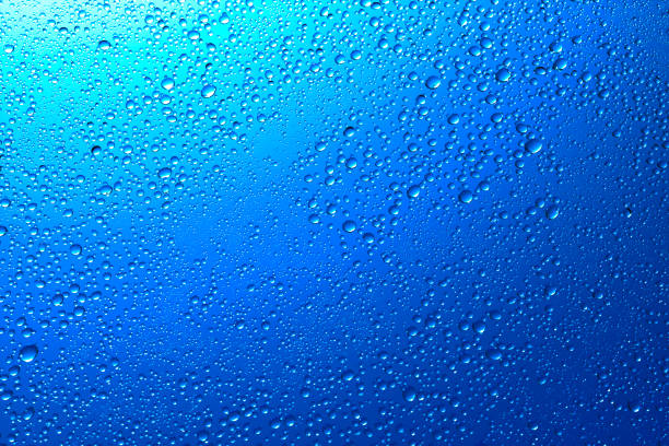 istock Sparkling water droplets on translucent blue 1186914854