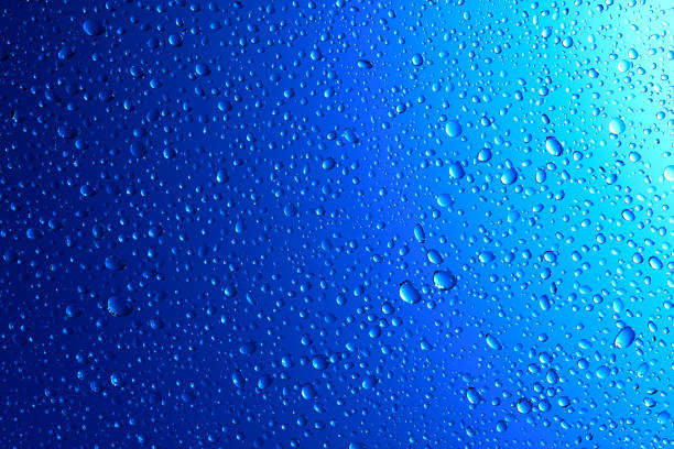 istock Sparkling water droplets on translucent blue 1186914887