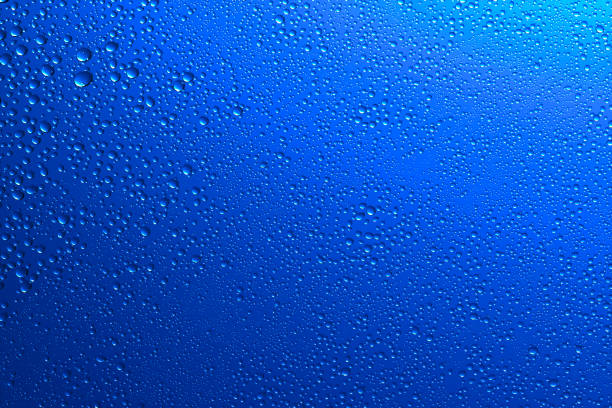 istock Sparkling water droplets on translucent blue 1186914910