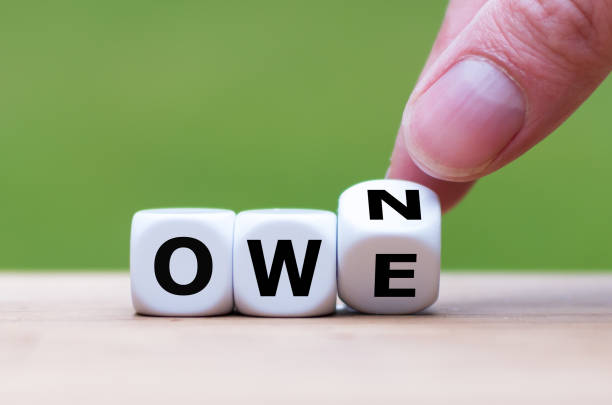 istock Hand turns a dice and changes the word 