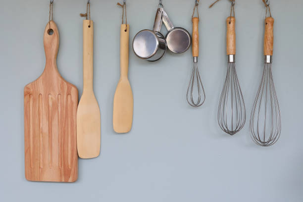 istock cooking kitchenware hanging on wall in kitchen room 1186919244