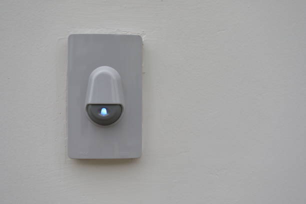 istock doorbell on white wall of front gate 1186919462