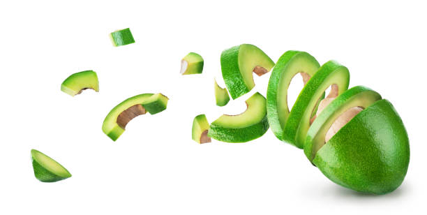 istock Avocado sliced and falling isolated on a white background 1186919547