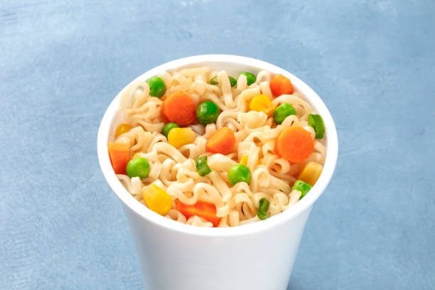 istock Ramen cup close-up, instant soba noodles in a plastic cup with vegetables 1186919558