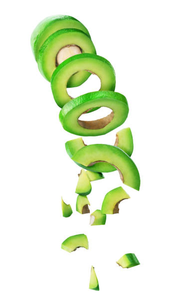 istock Avocado sliced and falling isolated on a white background 1186919565