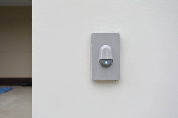 istock doorbell on white wall of front gate 1186919588