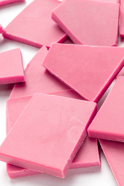 istock Ruby chocolate slices, a close-up of a heap on a white background 1186919662