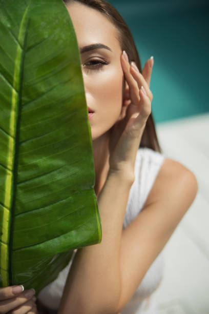 istock Beautiful lady touching her face with a hand 1186919988