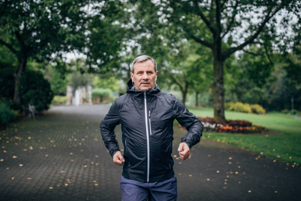 istock Senior man running over the bridge 1186920192