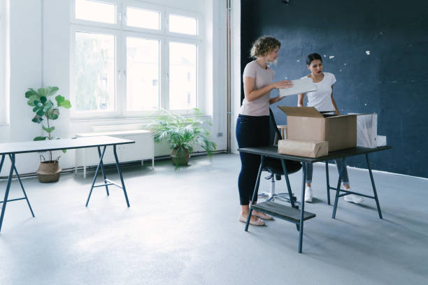 istock Young entrepreneurs moving into a new office 1186921887