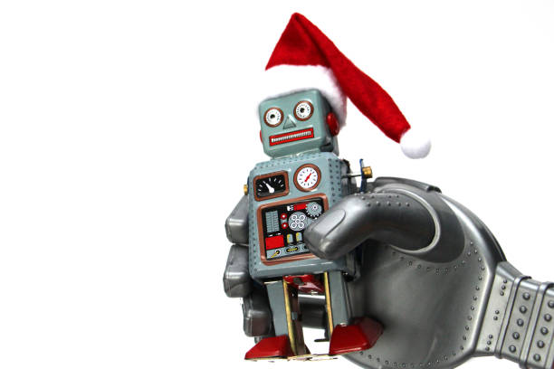 istock The robot holds a small retro robot in his hand. 1186923193