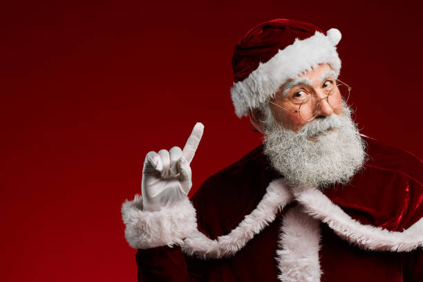 istock Santa Claus Pointing Up 1186923456