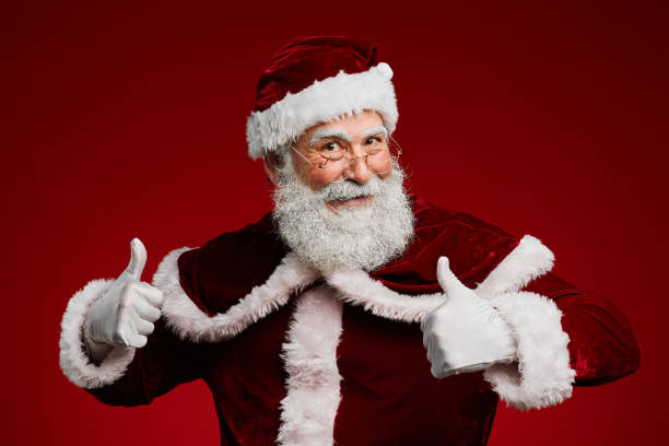 istock Santa Claus Showing Thumbs Up on Red 1186923462