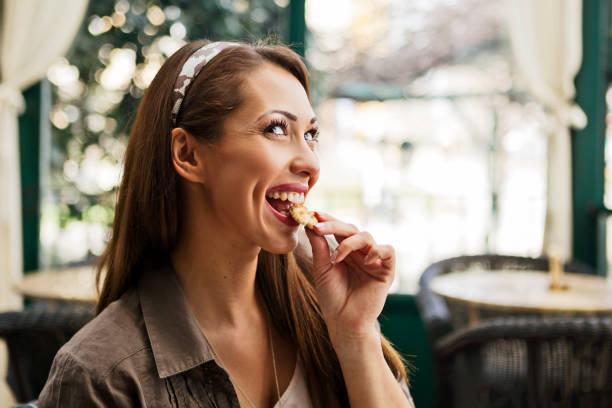 istock Woman enjoying cookie 1186923662