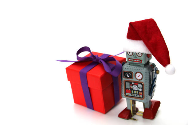 istock Retro robot with a big gift box. The robot has a Santa hat. 1186924453
